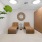 a room with a plant and chairs
